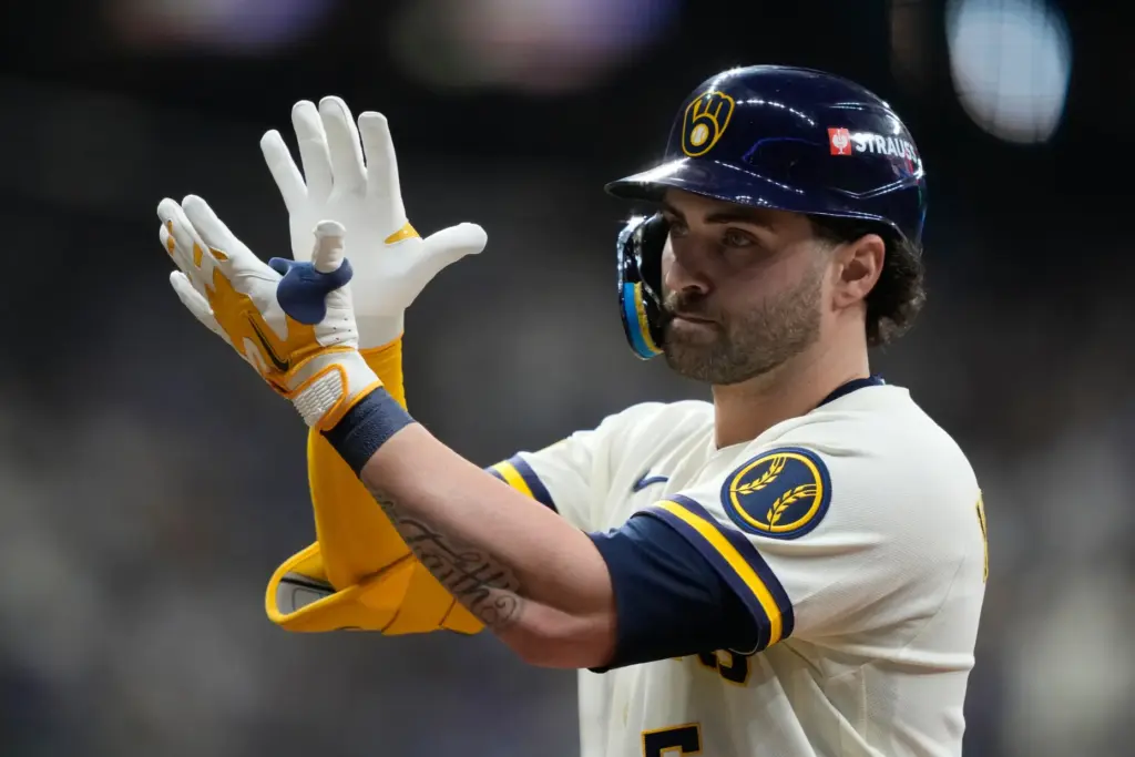 The Milwaukee Brewers’ Garrett Mitchell celebrates after hitting a single...