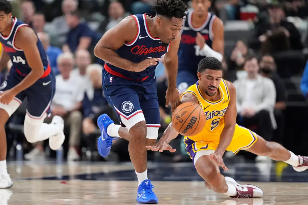 Clippers guard Jalen Pickett, left, and Lakers guard Quentin Grimes...