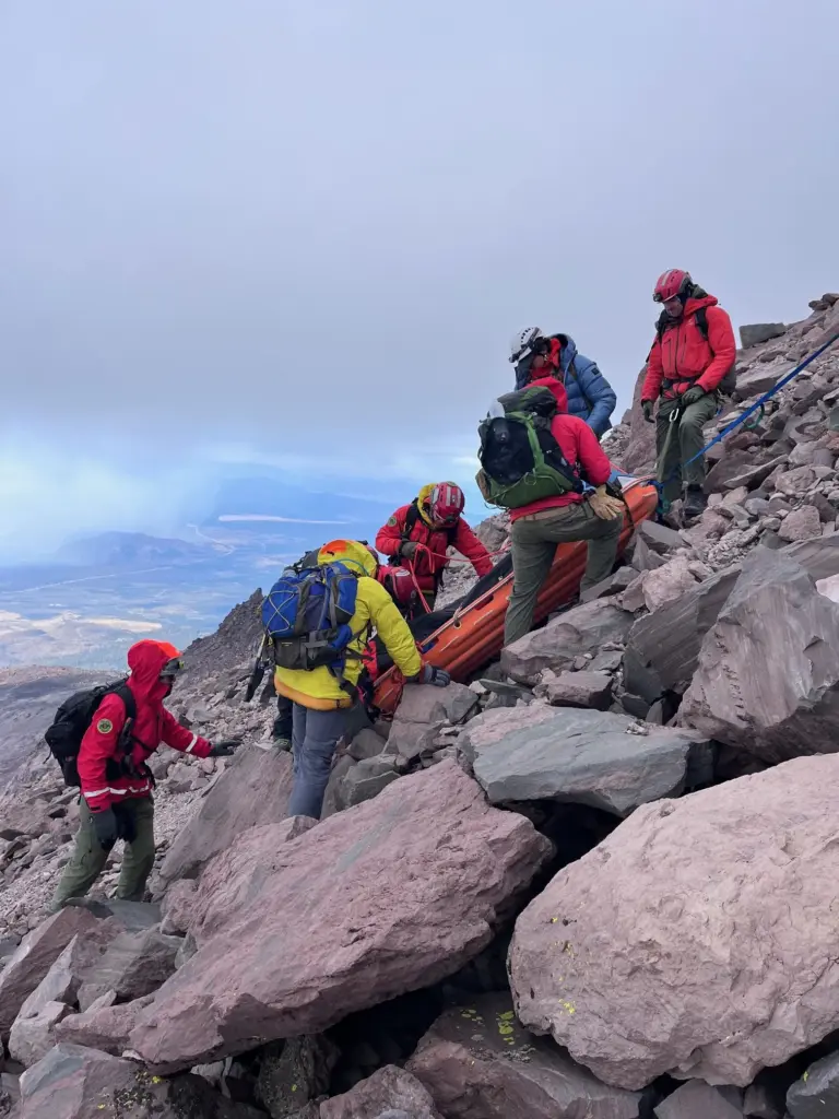 A team of volunteers from multiple agencies, climbed to the...