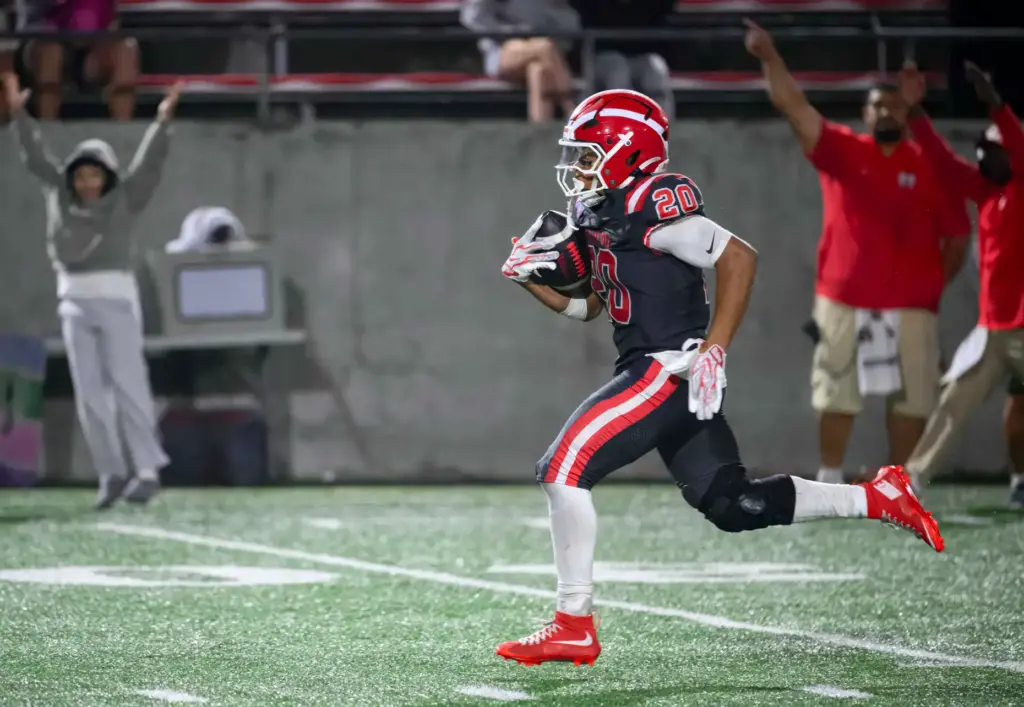Mater Dei running back Asir Nembhard sprints into the open...