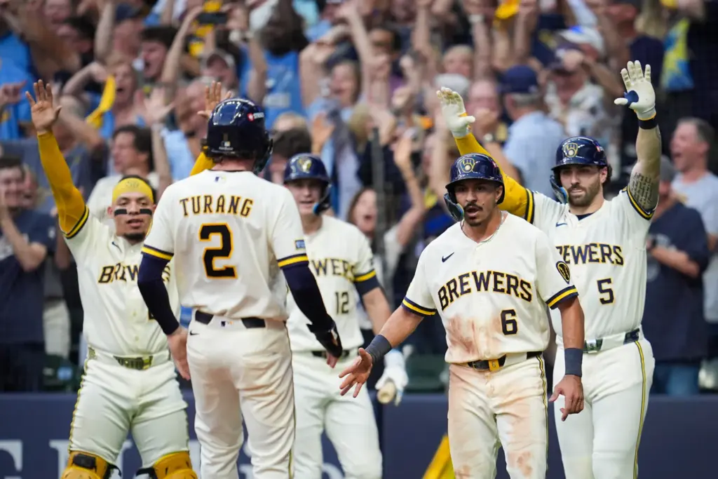The Milwaukee Brewers’ Brice Turang (2) scores on a two-run...