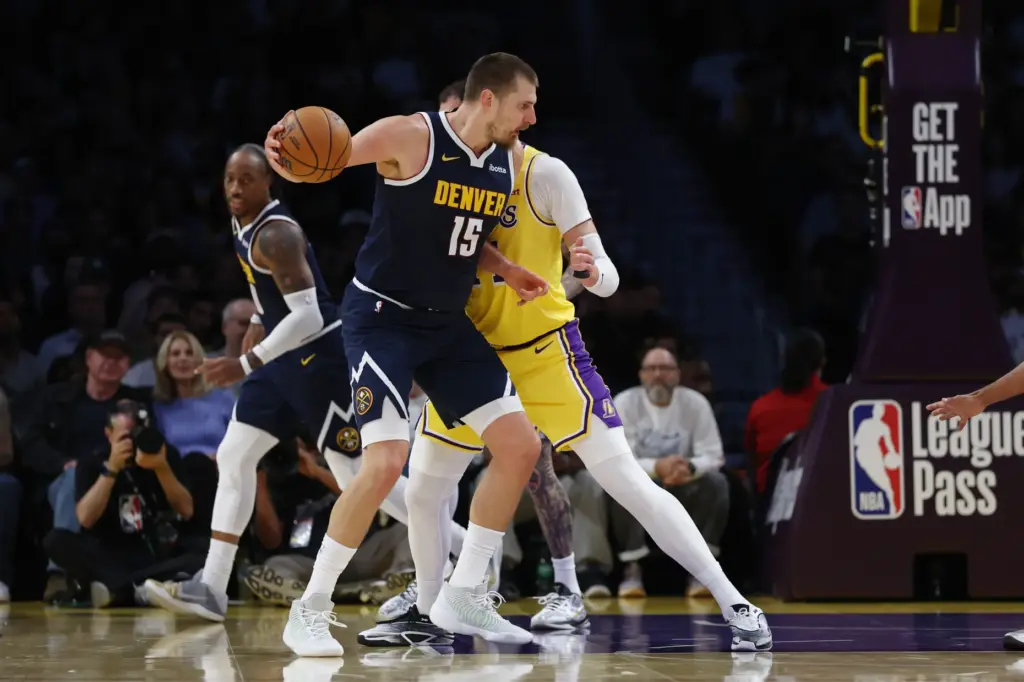 Denver Nuggets center Nikola Jokic holds the ball during the...