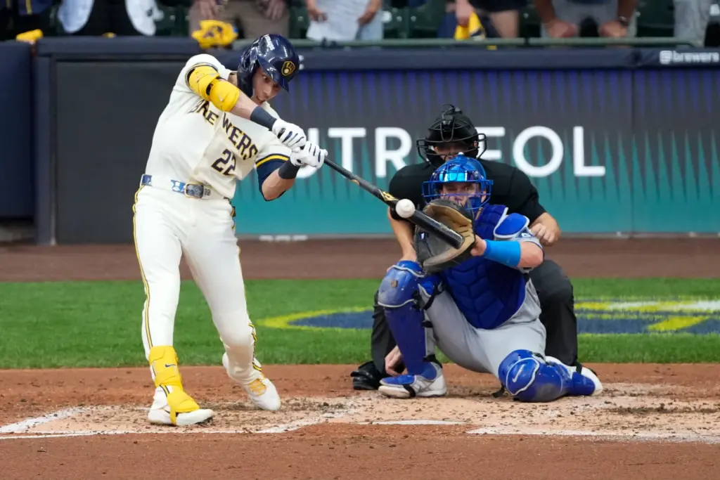 Milwaukee Brewers designated hitter Christian Yelich hits a two-run single...