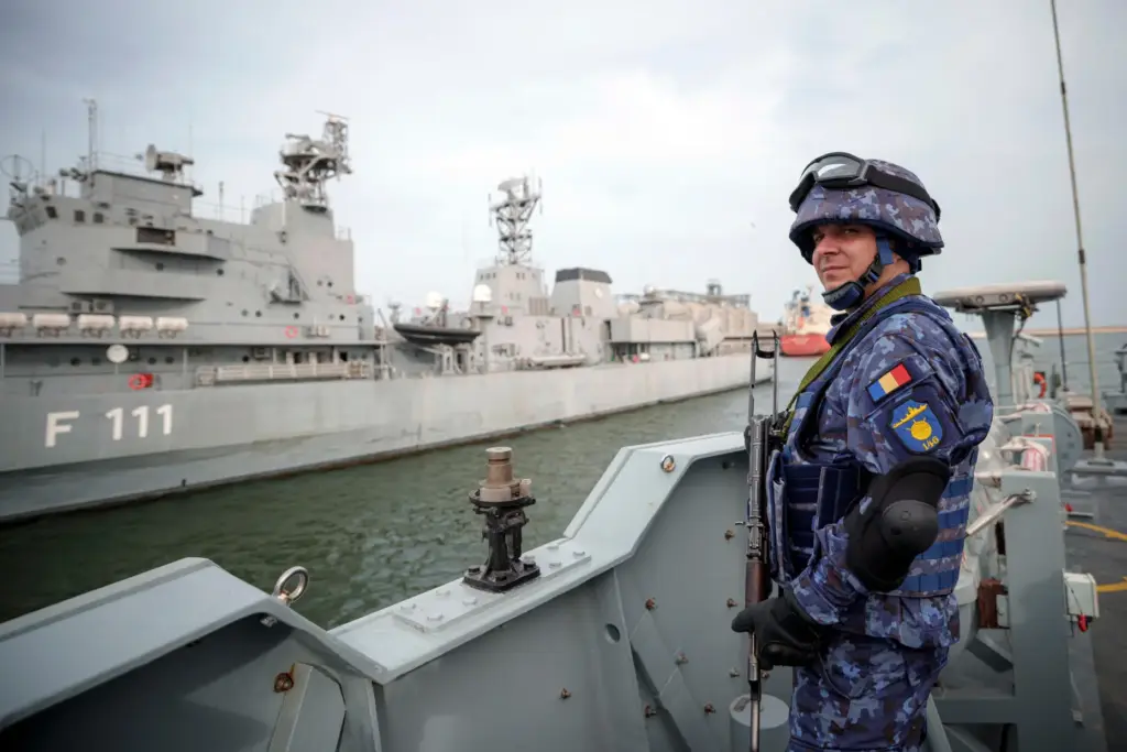 FILE – A Romanian naval serviceman guards onboard the M-270...