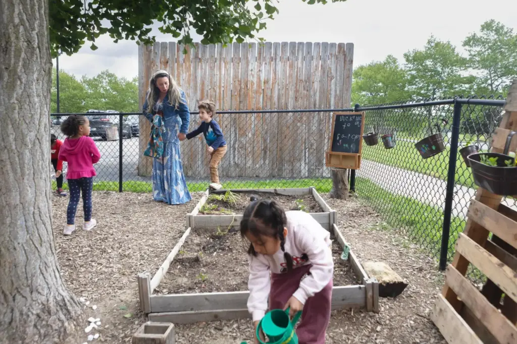 Diana McGuire leads her 4-year-old son Noah by the hand across the playground.