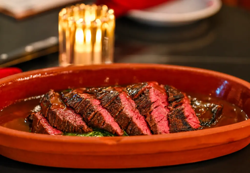 Outside Skirt Steak; coconut creamed collard greens, Sichuan vinegar sauce...