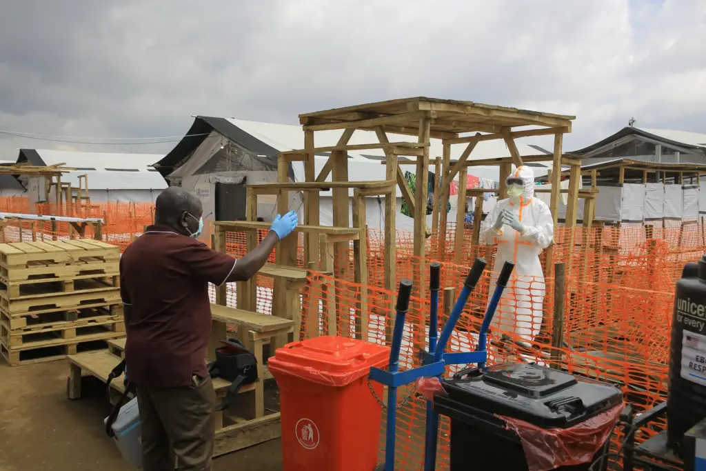 Health workers talk inside a Ebola treatment camp in Butembo, Congo.