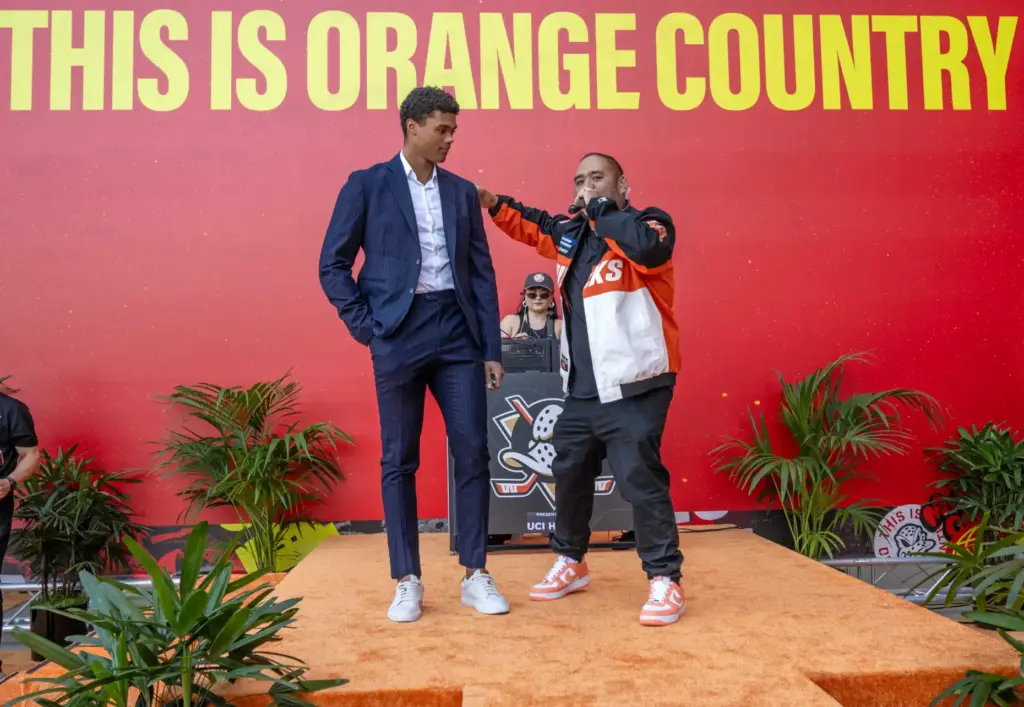 Ducks DJ JoJo Maestrado, known as DJ JoJo, right, introduces...