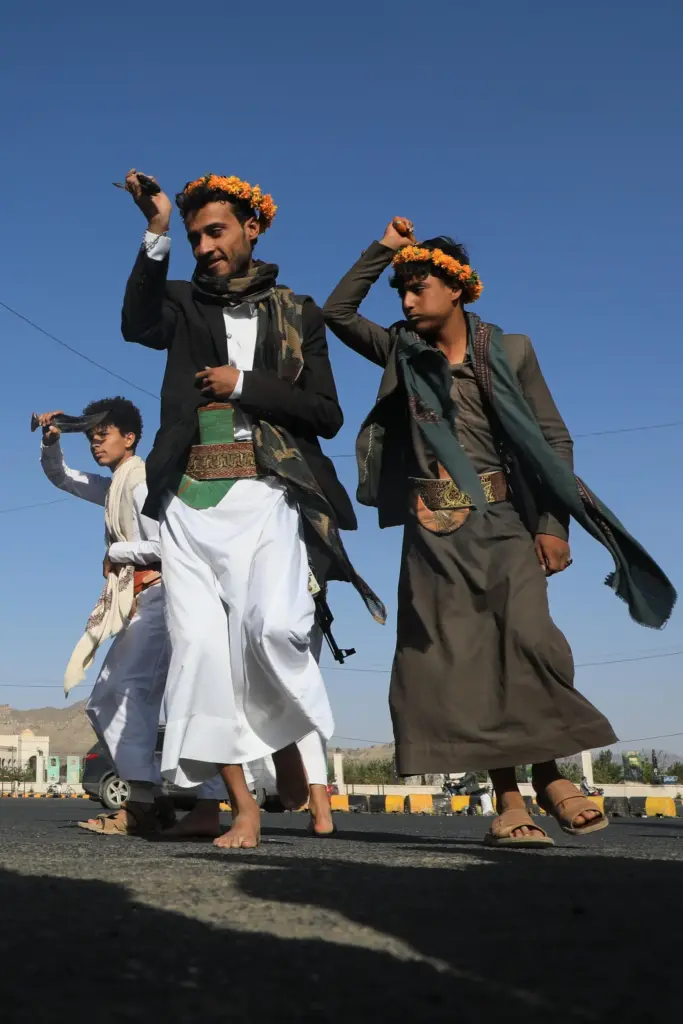 Men dance during a wedding celebration in a street in...