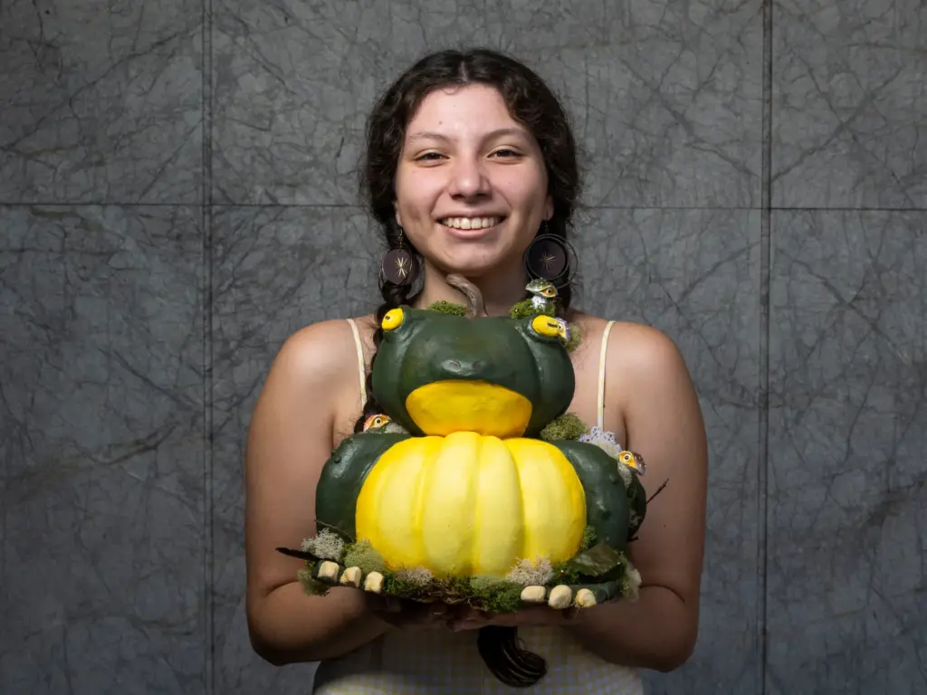 Edlyn Lozano holds her pumpkin titled âBig King Toadâ which...