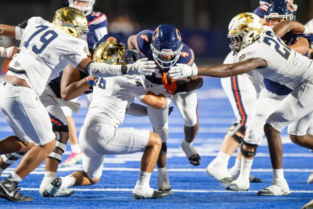 Chaminade High Schoolâs Marquis Jones (4) attempts to break through...