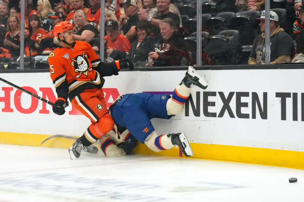 Edmonton Oilers right wing Kasperi Kapanen, right, runs head-first into...