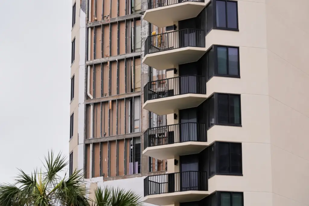 Damage is seen as a side of a condominium high-rise...