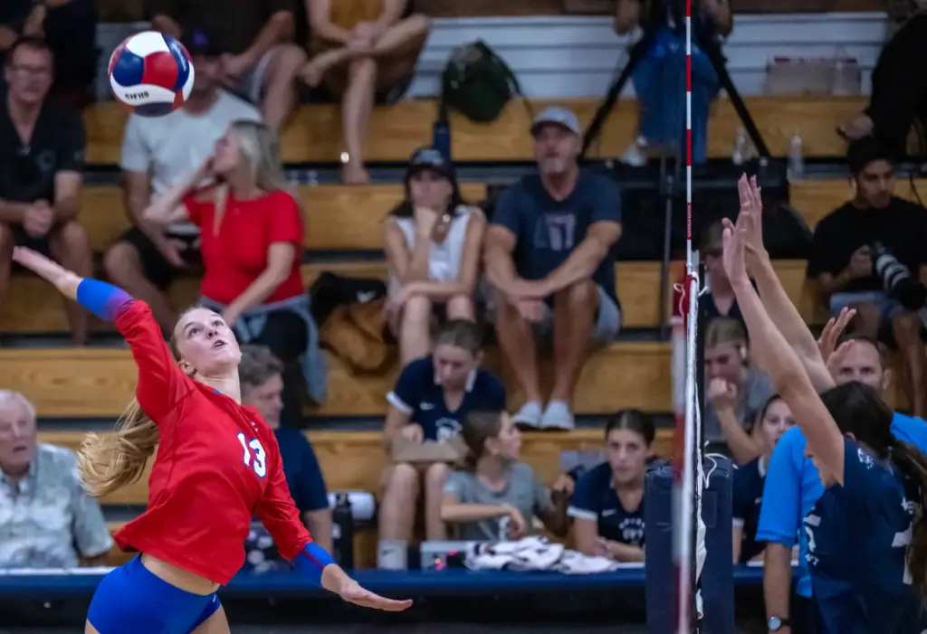 Los Alamitos outside hitter Charlotte Hall (13) hits the ball...