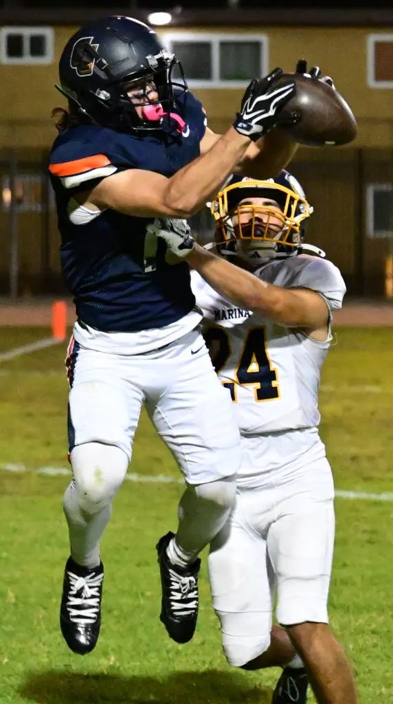 Matt Rodriguez #18 of Cypress catches a TD pass in...