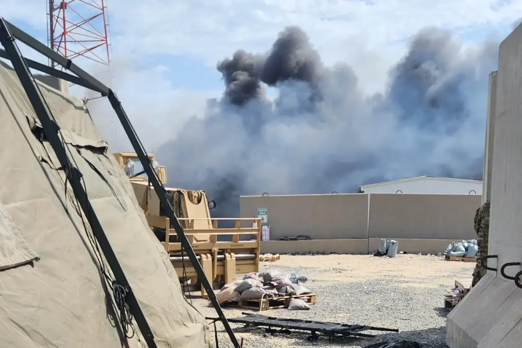In this photo obtained by The Associated Press, smoke rises...