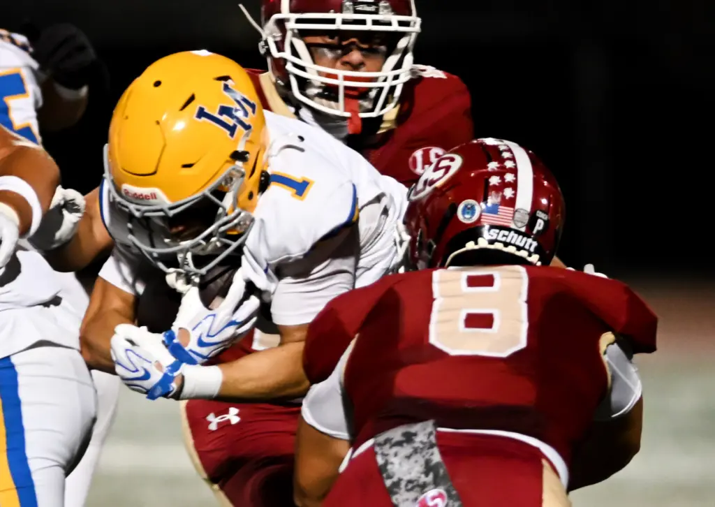 La Mirada Matadores running back Josiah Fregoso (1) is tackled...