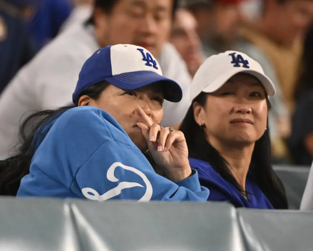 Dodgers fans look on during the ninth inning of Game...