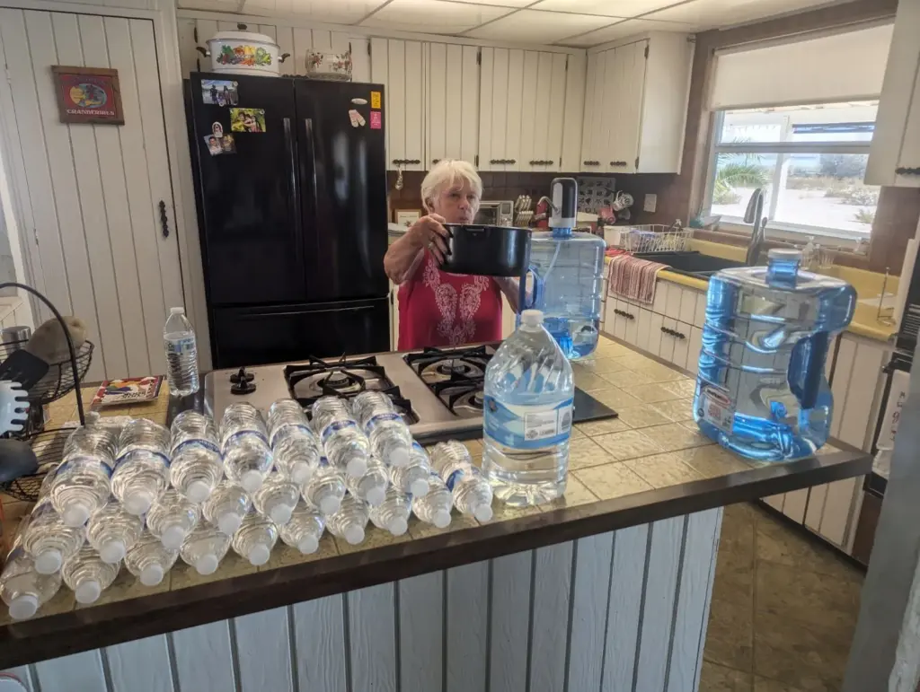 Havasu Lake resident Karen Chamberlain boils water on her stove...