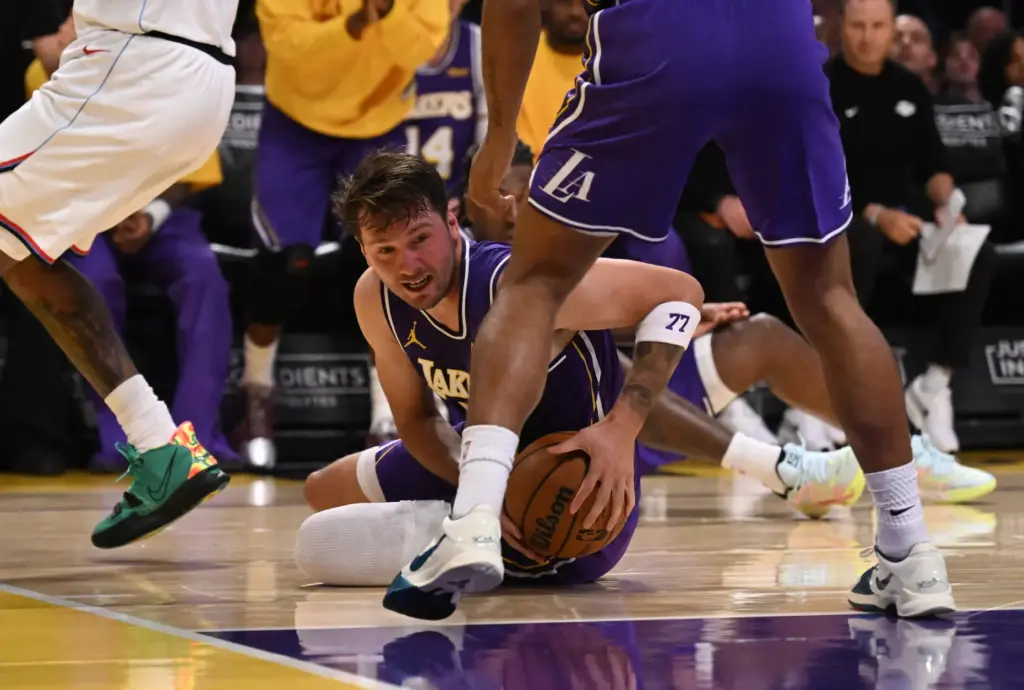Lakers star Luka Doncic scrambles for a loose ball during...