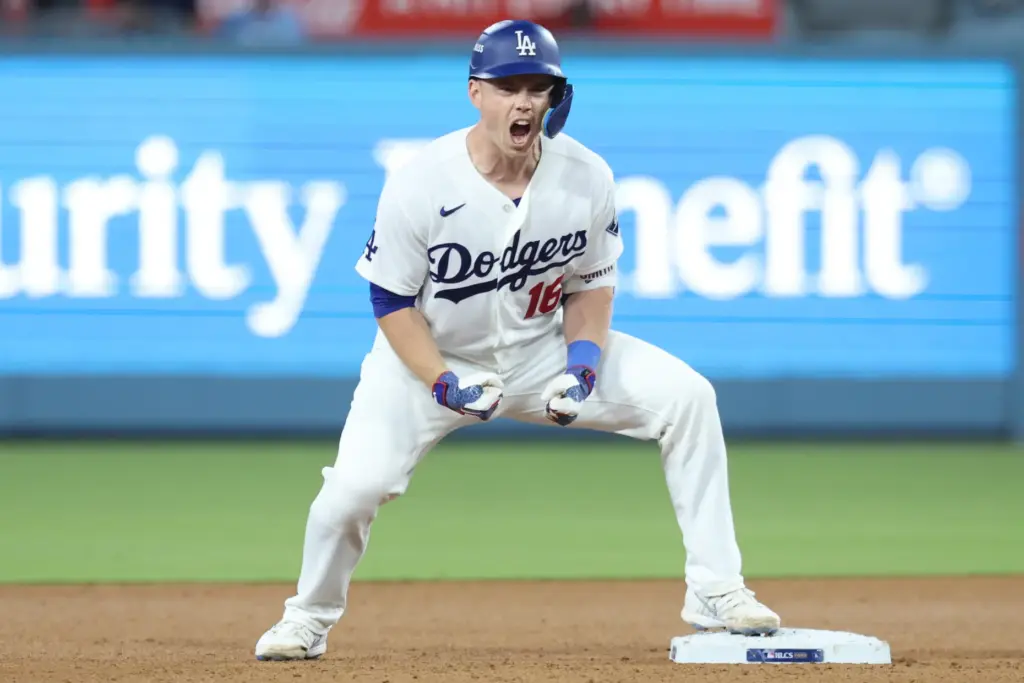 The Dodgers’ Will Smith celebrates at second base after hitting...