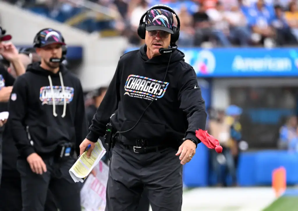 Chargers head coach Jim Harbaugh drops the challenge during the...