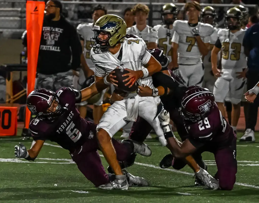 El Segundo quarterback Ryan Wiacek runs with the ball during...