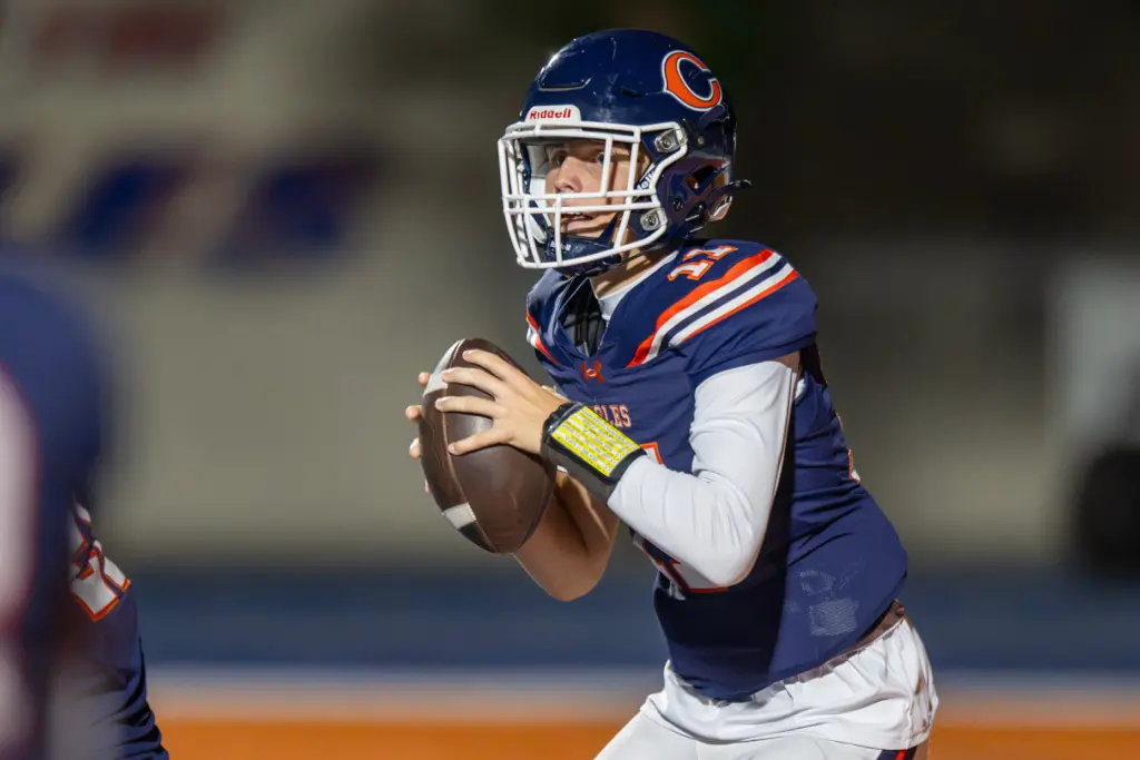 Chaminade High School’s Hendrix Coleman (17) drops back to pass...