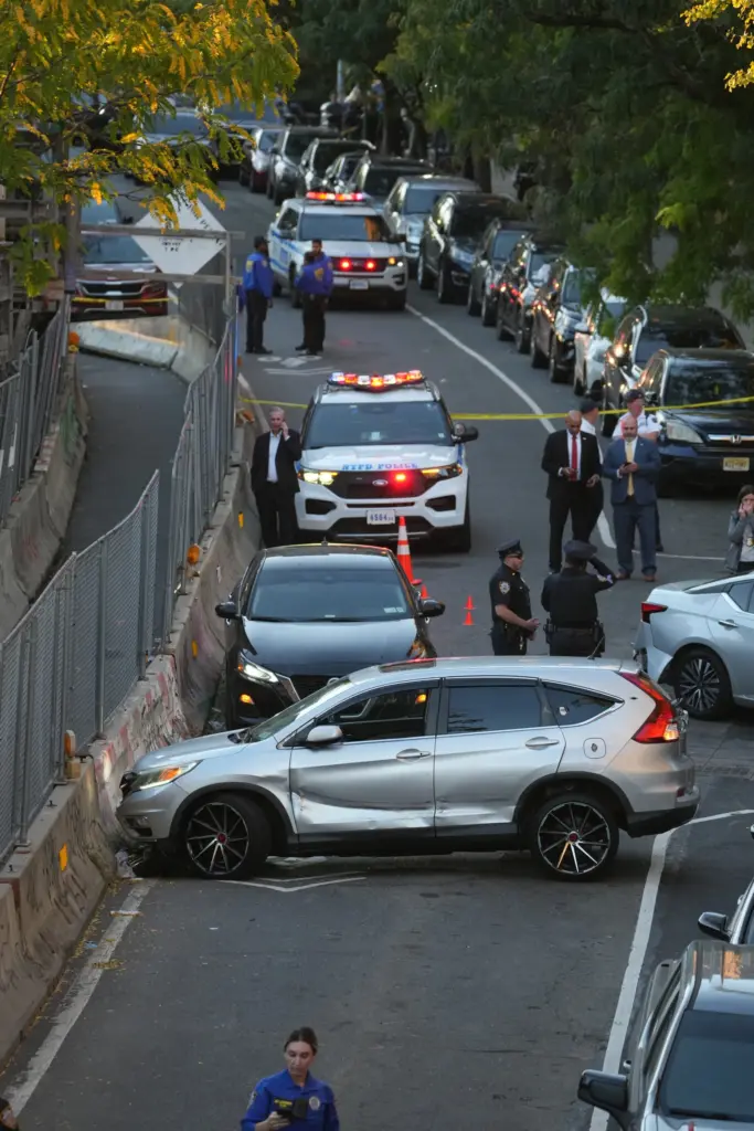 Law enforcement officers investigate after ICE agents shot and wounded...