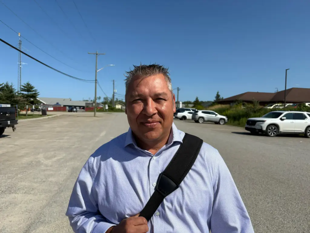 Chief Tim Ominika stands on a street in Wiikwemkoong, Ontario, Canada.