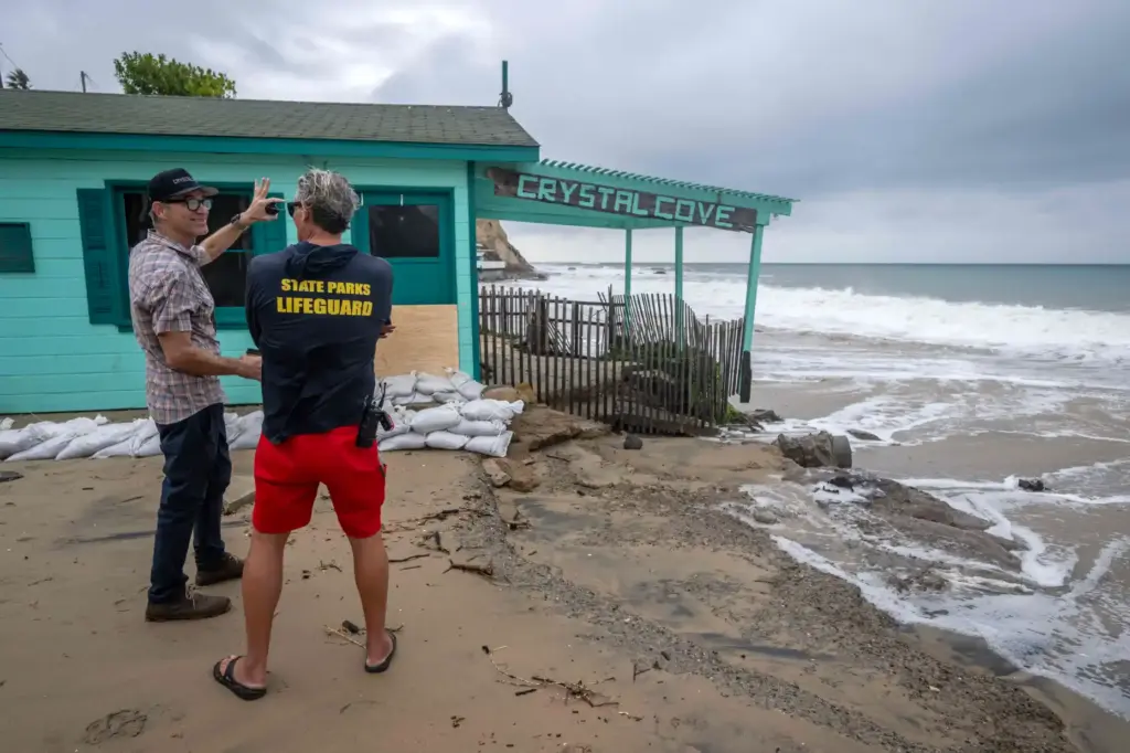 Crystal Cover State Beach staff and lifeguards look on as...
