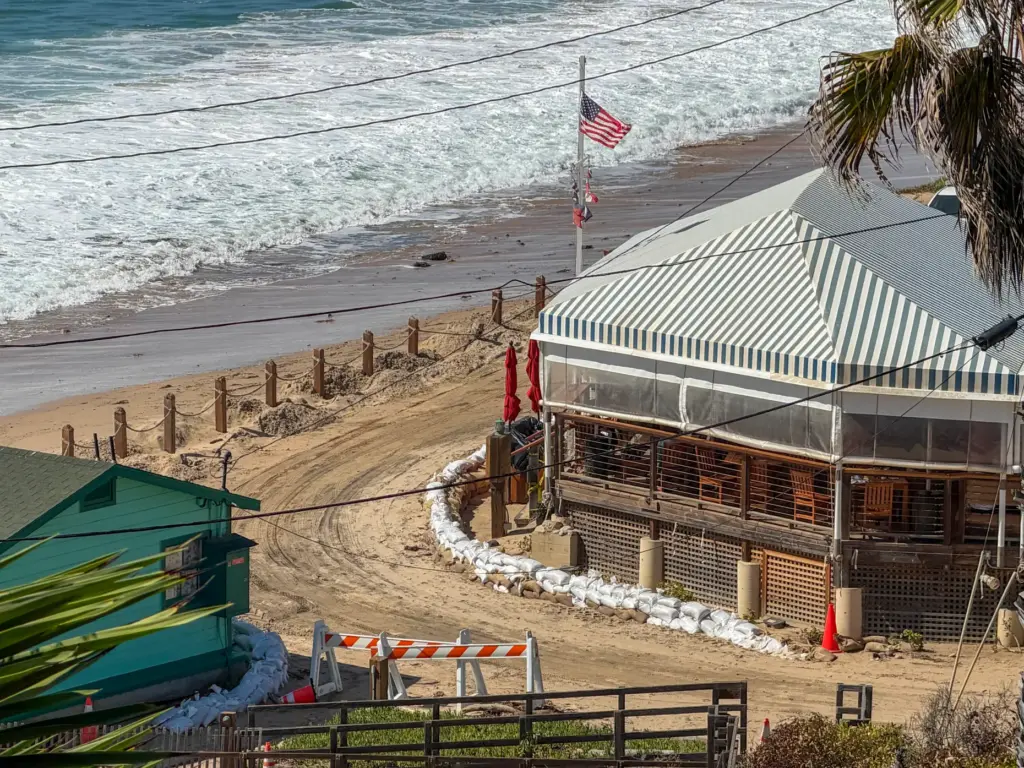 Sandbags surround The Beachcomber at The Historic District at Crystal...