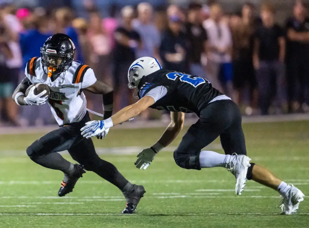 Huntington Beach running back Dallas “DJ” Miller (5) carries the...