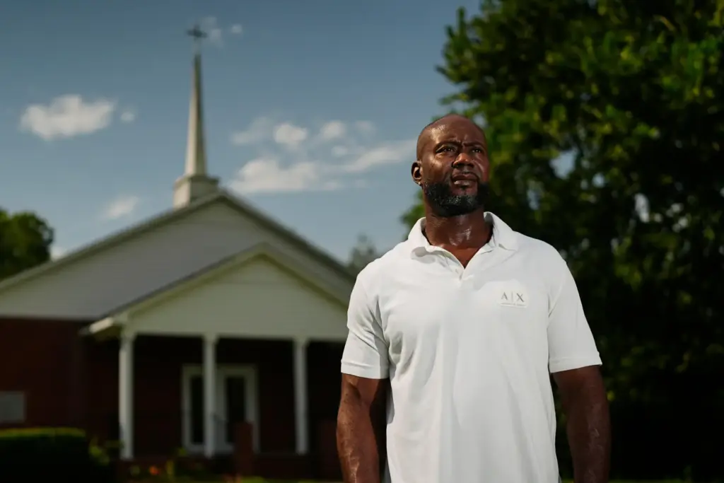 Patrick Dewayne Smith poses for a portrait outside his church...