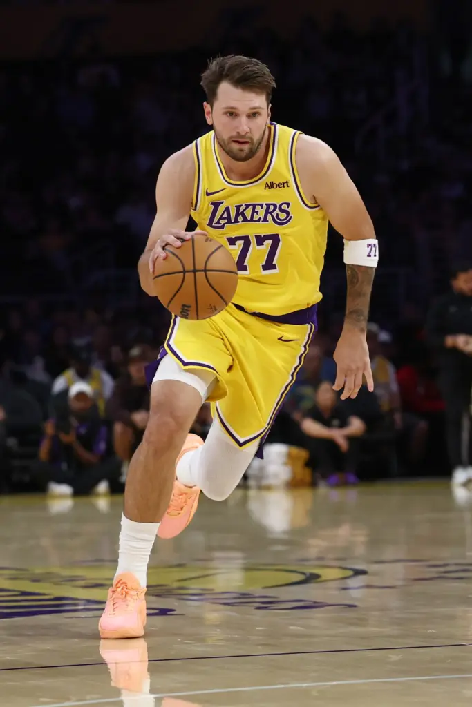 Lakers guard Luka Doncic brings the ball up the court...