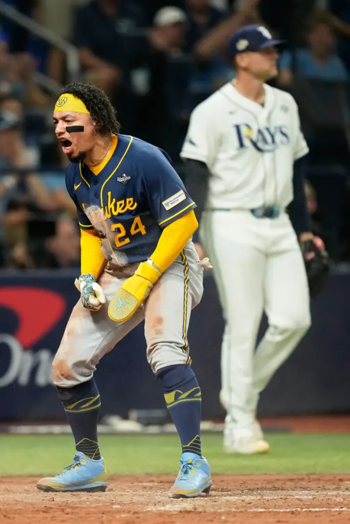 The Milwaukee Brewers’ William Contreras celebrates after scoring during the...