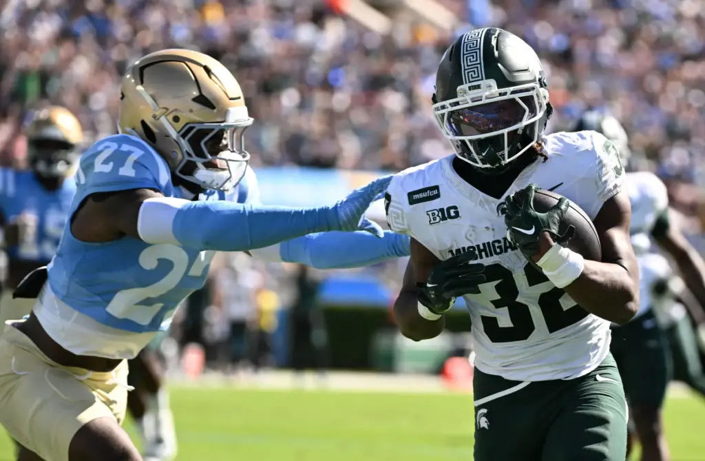 Michigan State running back Kenneth Williams (32) runs past UCLA...