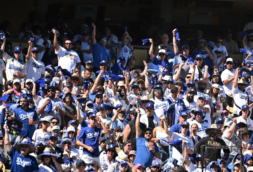 Dodgers fans wave their towels during the first inning of...