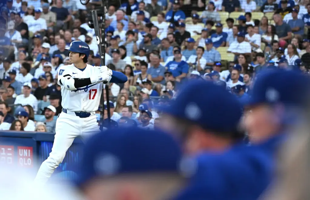 Dodgers star Shohei Ohtani waits on deck during the third...