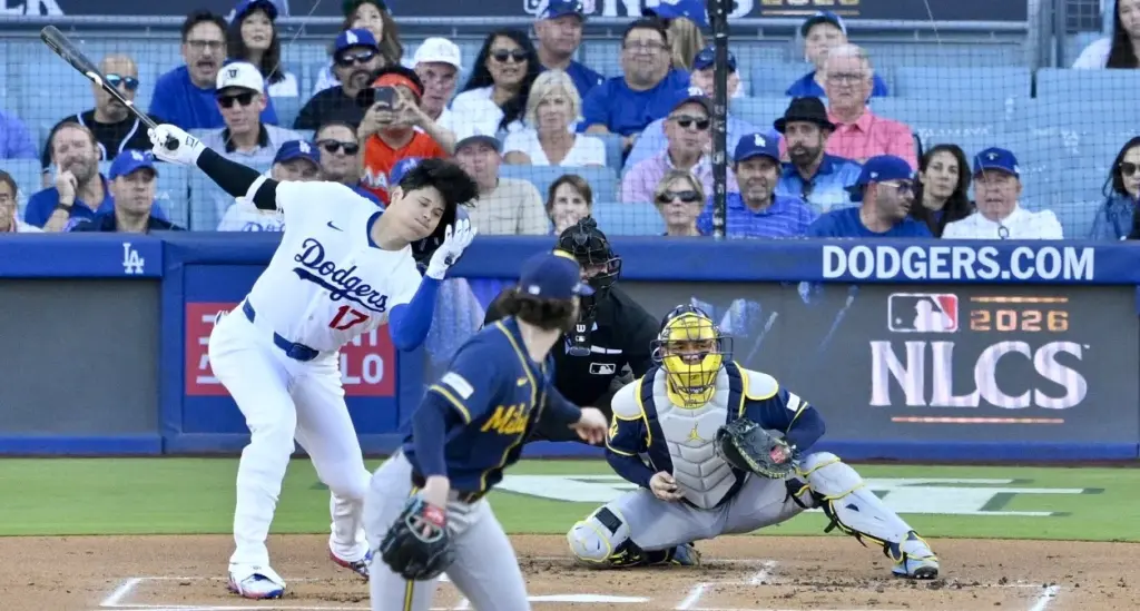 Dodgers star Shohei Ohtani loses his helmet as he strikes...