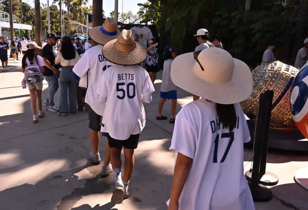 Dodgers fans make their way around the Centerfield Plaza before...