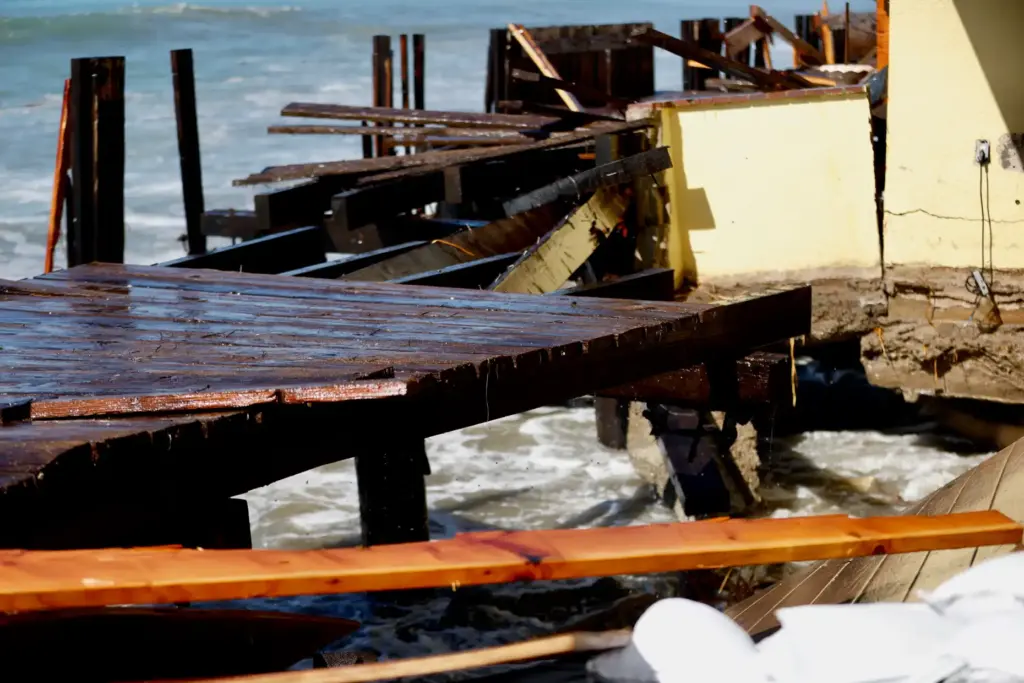 A heavily damaged portion of the Peninsula boardwalk continues to...