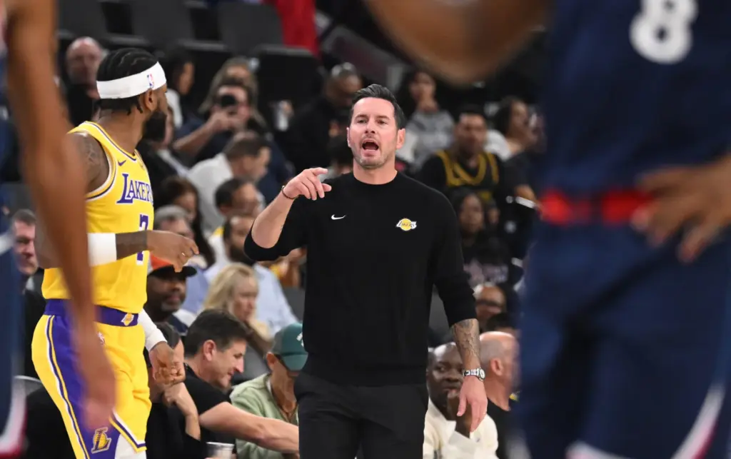 Lakers head coach JJ Redick instructs his players from the...