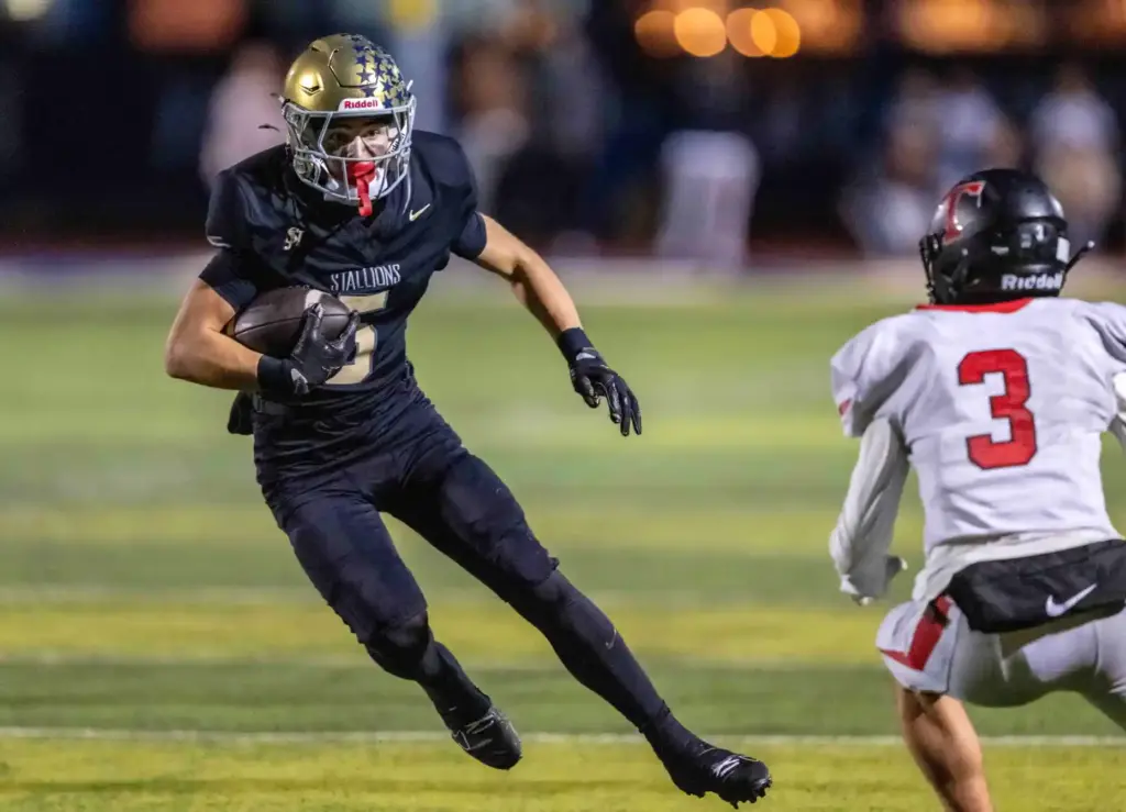 San Juan Hills wide receiver Luke Frith (5) carries the...