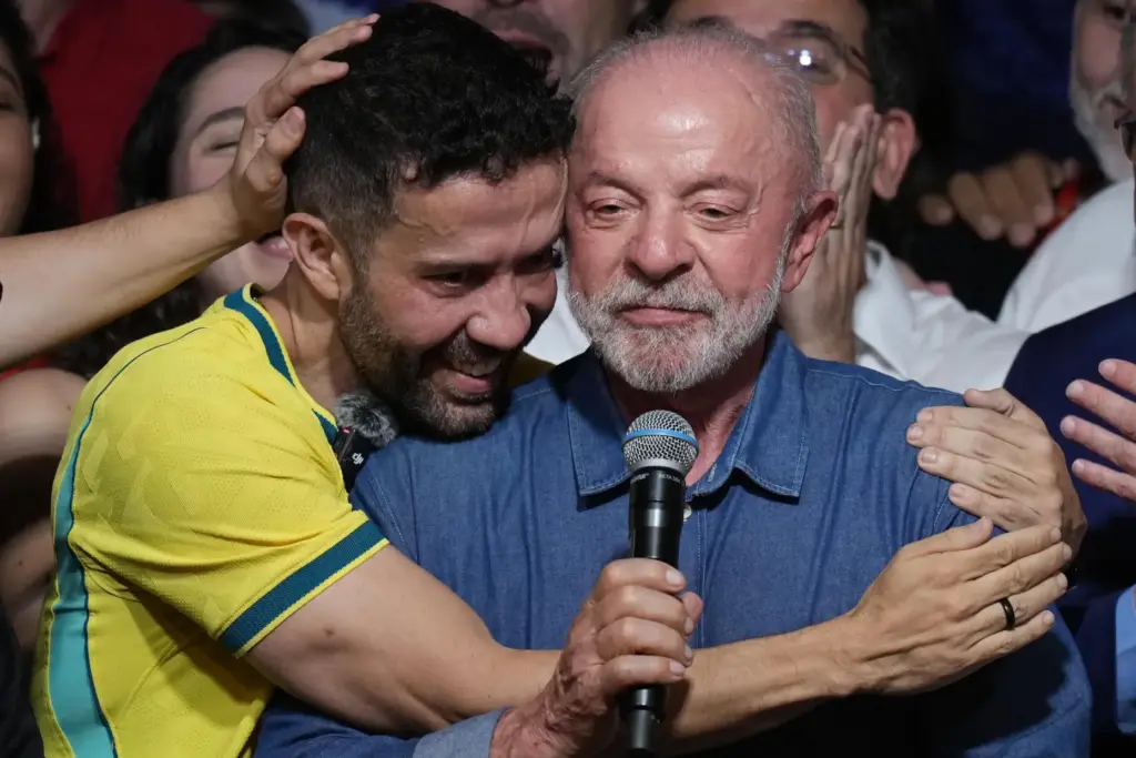 Brazilian lawmaker Andre Janones embraces President Luiz Inacio Lula da Silva.