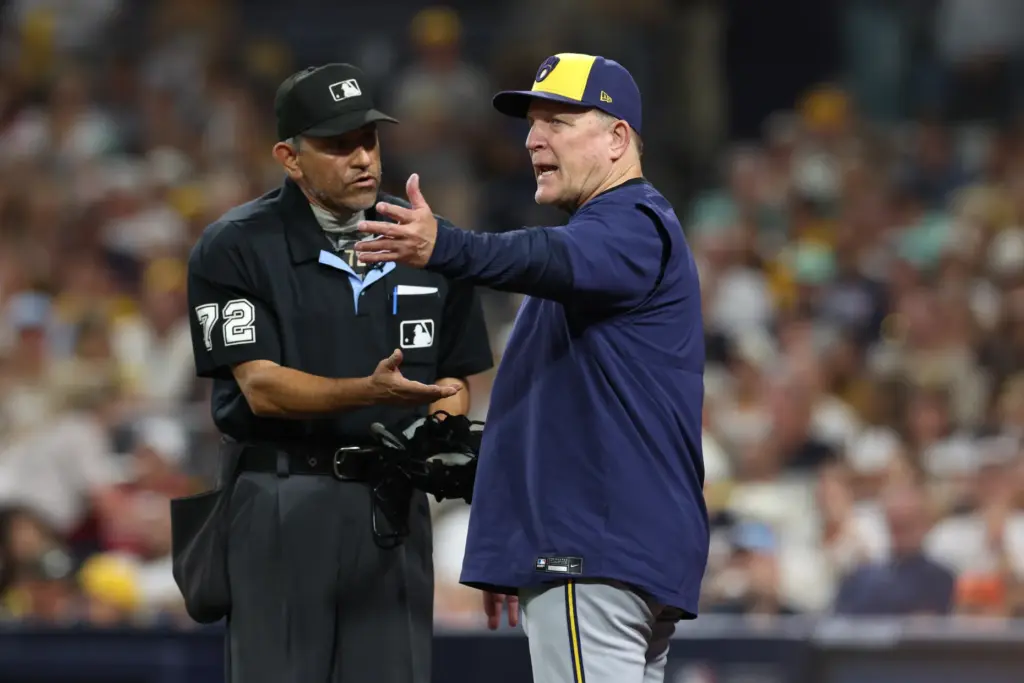 Milwaukee Brewers manager Pat Murphy, right, talks with home plate...