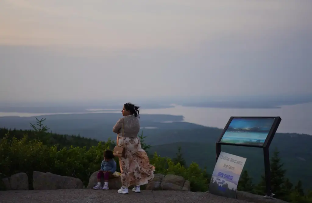 Visitors at the summit of Cadillac Mountain in Acadia National...