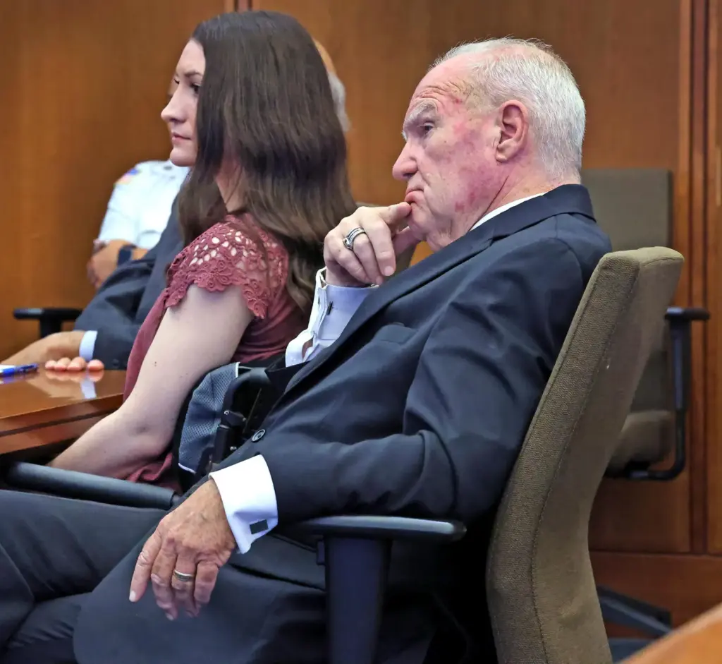 Defendant Lindsay Clancy and attorney Kevin Reddington listen to the...