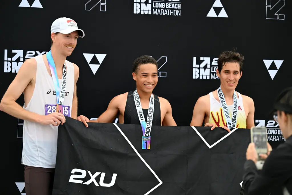 Xavier Smith, center, wins the 2026 2XU Long Beach Marathon...