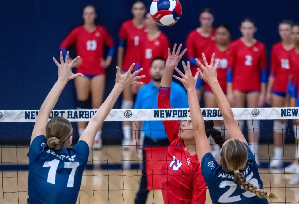 Los Alamitos outside hitter Tyleani Allen (19) hits the ball...